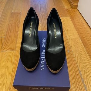 Stuart Weitzman women’s suede shoes on a wedge.